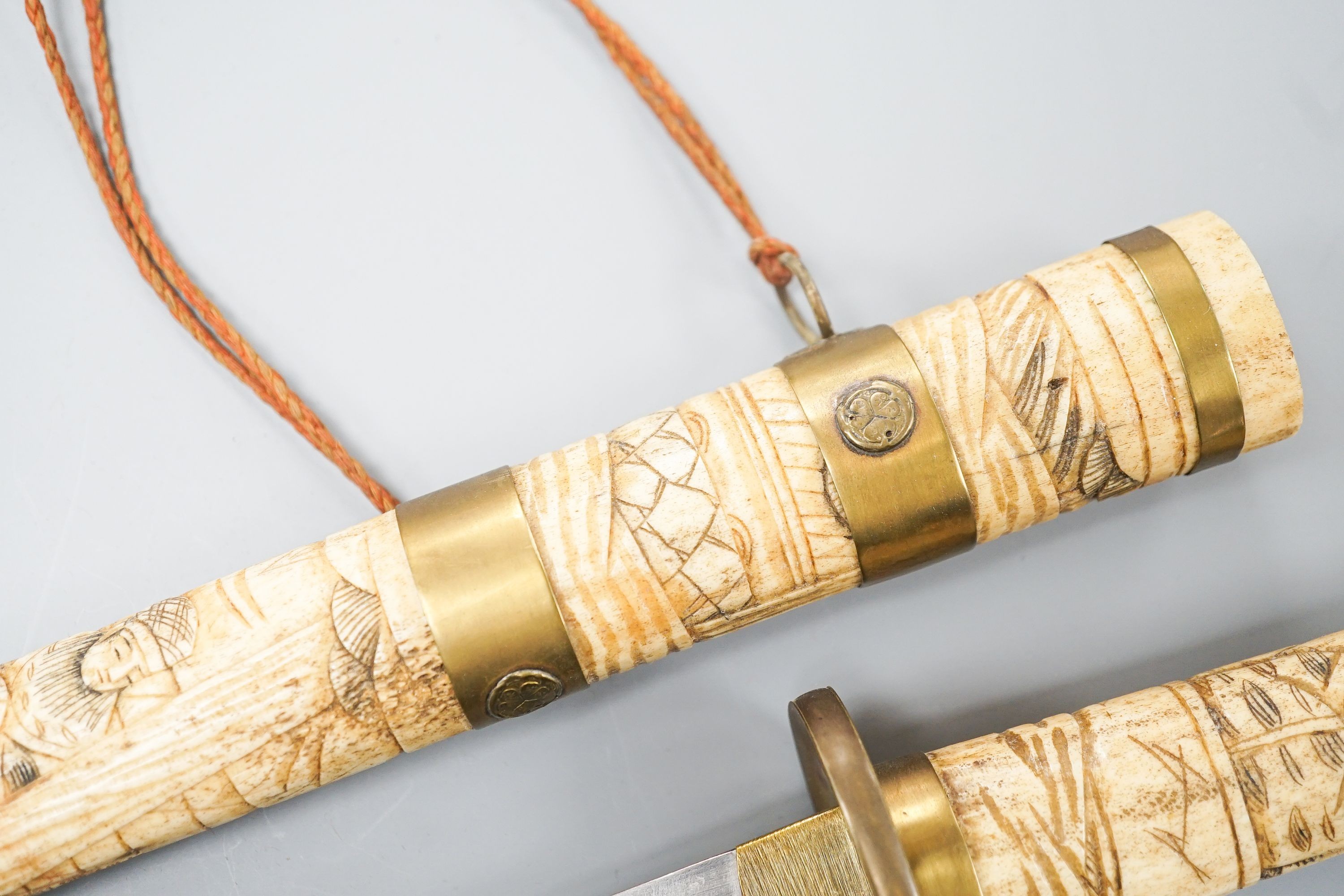 A 20th century bone and brass mounted tanto sword